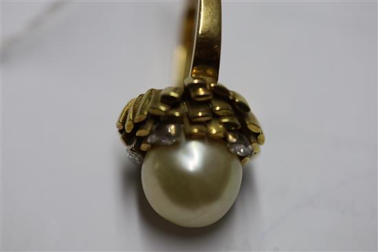 An 18ct gold, diamond and cultured pearl dress ring by John Donald, circa 1970, in modernist setting, size P/Q.